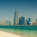 Abu Dhabi city skyline across the sea during the day