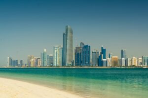 Abu Dhabi city skyline across the sea during the day