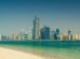 Abu Dhabi city skyline across the sea during the day