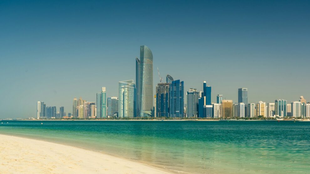 Abu Dhabi city skyline across the sea during the day