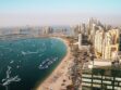 Aerial view of Dubai coastline with residential towers and apartment buildings