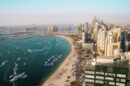 Aerial view of Dubai coastline with residential towers and apartment buildings