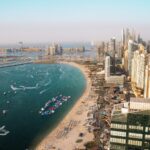Aerial view of Dubai coastline with residential towers and apartment buildings