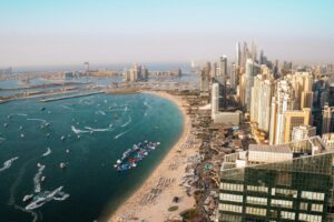 Aerial view of Dubai coastline with residential towers and apartment buildings