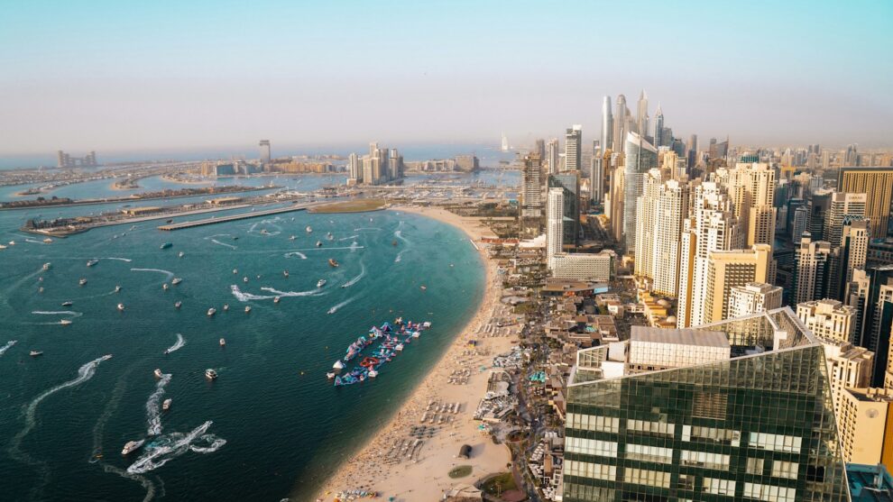 Aerial view of Dubai coastline with residential towers and apartment buildings