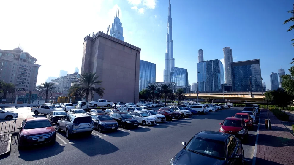 Cars parked in a designated public parking zone in Dubai