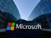 Microsoft sign in front of glass office buildings