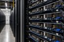 Server racks in a data center as SpaceX secures debt for AI chip expansion