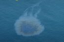 UAE oil spill: oil slick spreading on the sea surface off the coast