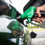 UAE petrol prices for November: driver refuelling a car at a petrol pump